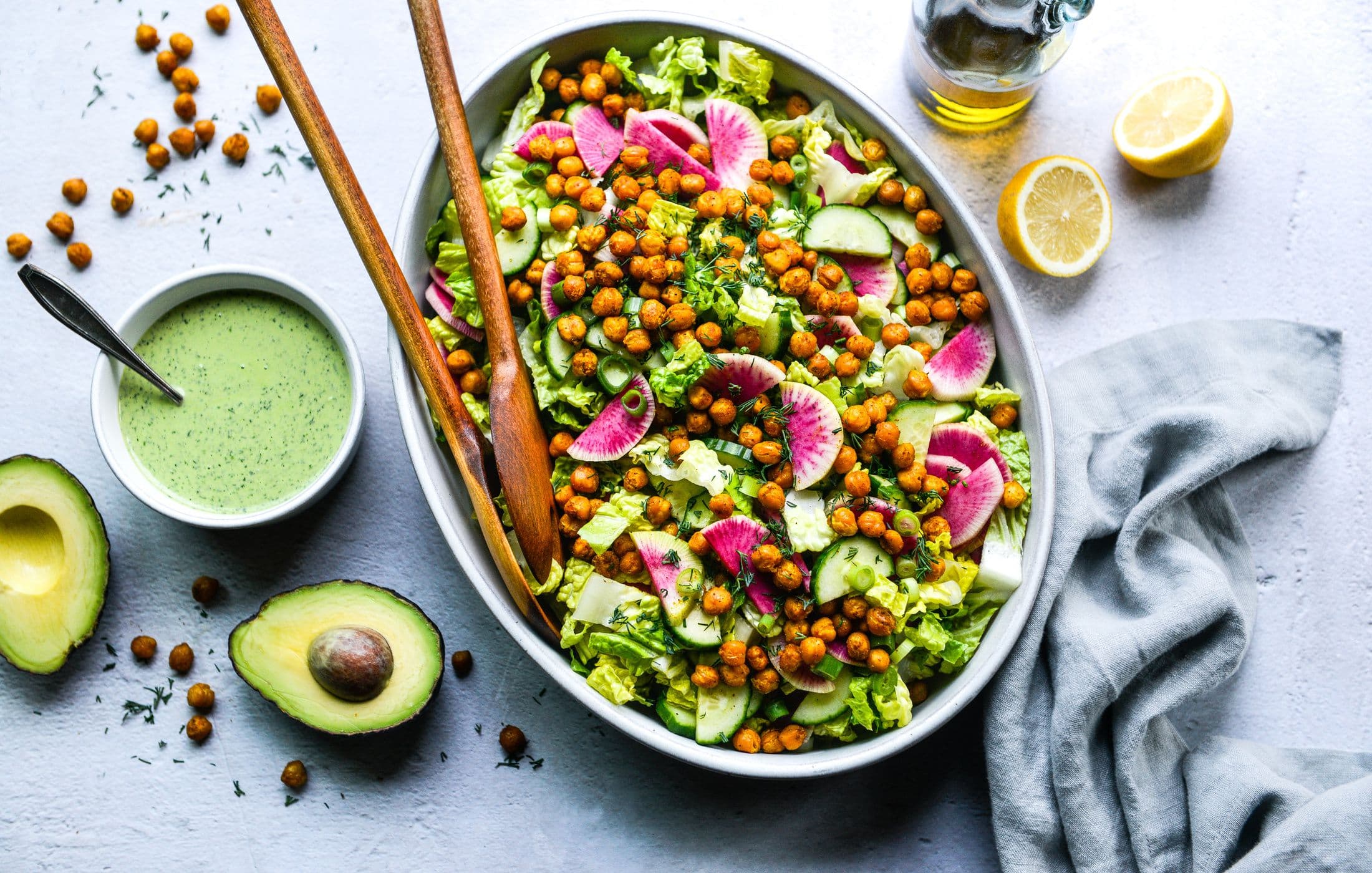 Colorful organic salad with greens and herbs
